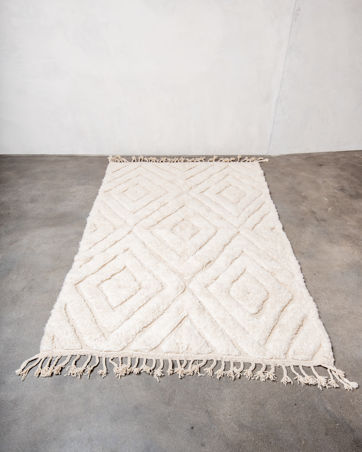 Modern, designer, handcrafted Berber rug from Morocco. Beniourain carpet with beautiful colours and patterns and fluffy wool texture.